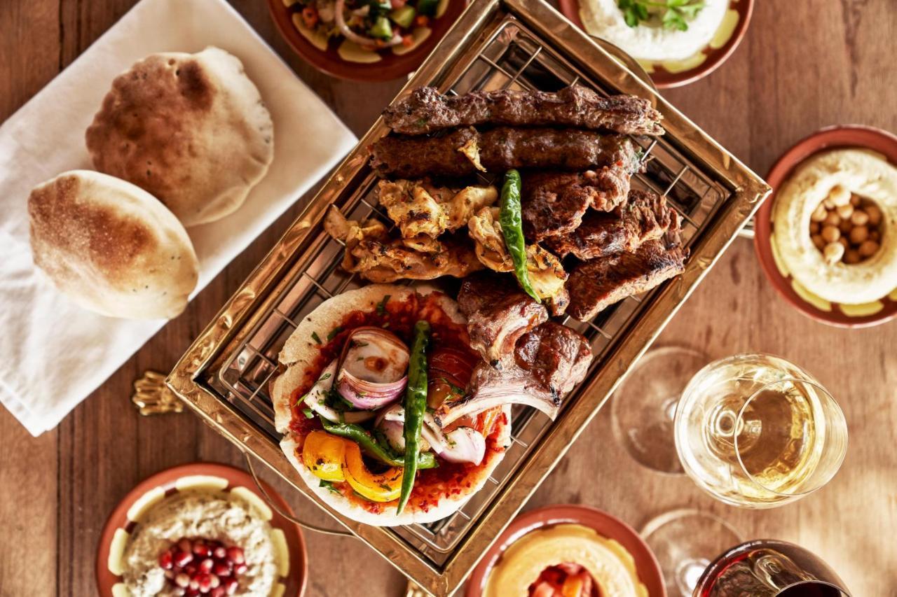 Fanar Hotel & Residences Salalah Extérieur photo A selection of Middle Eastern cuisine
